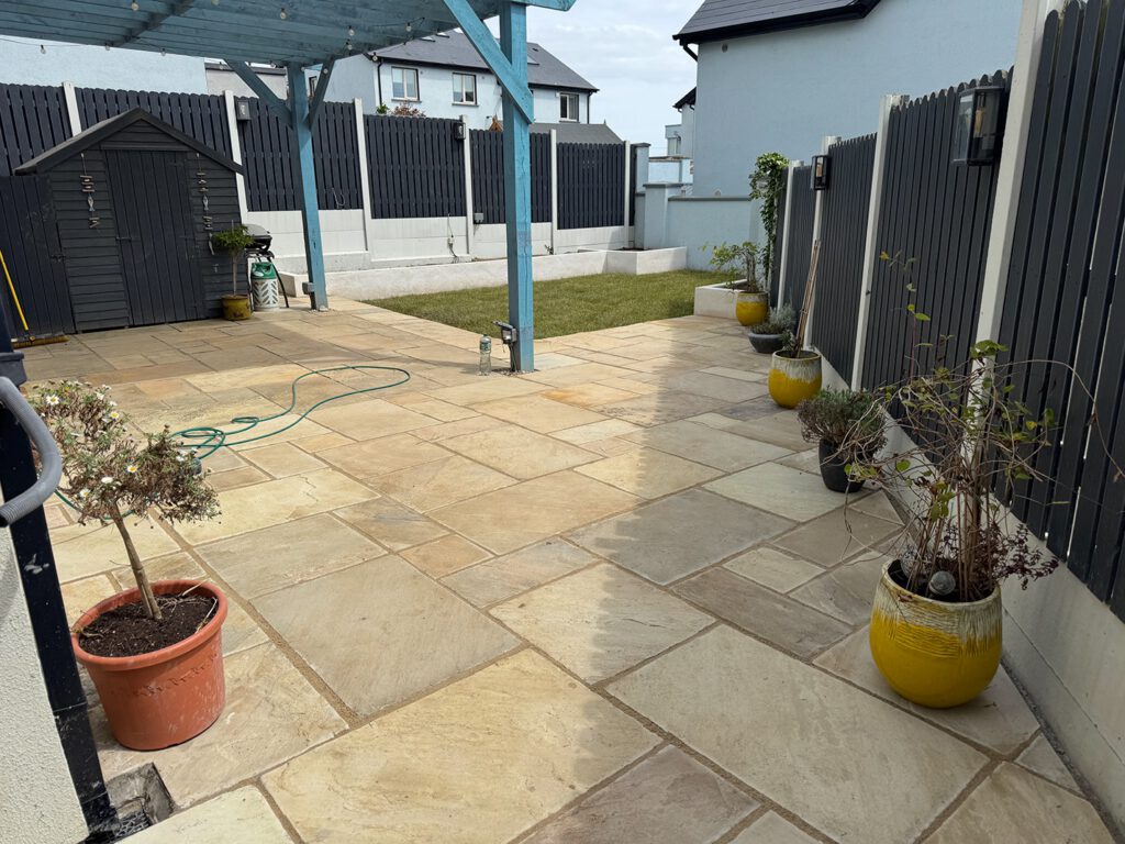A finished Cutting Hedge garden in Skerries β new sandstone patio, planter beds and fresh lawn